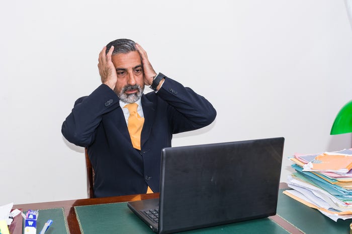 Scared Businessman at Computer