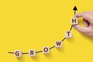Letters form "growth" on an upward curve