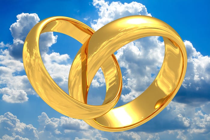 Wedding rings in clouds