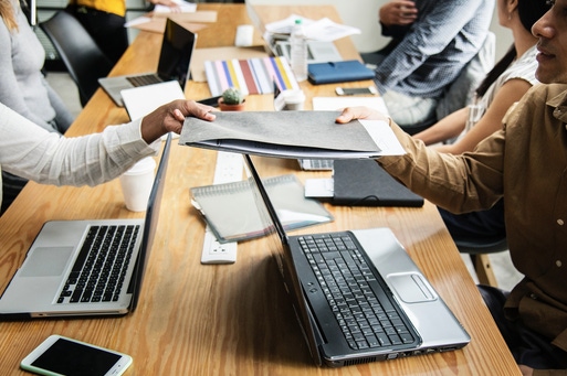 exchange over and laptops on conference table