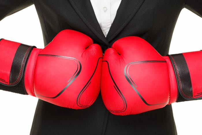 Businesswoman boxing