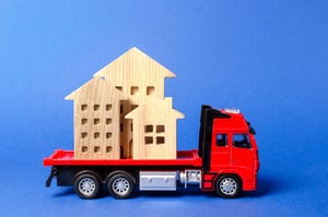 Toy truck moving toy buildings
