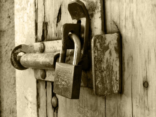 close up of bolt lock with padlock