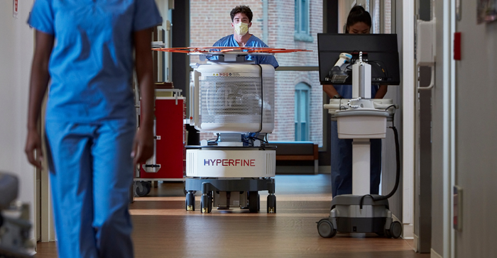 Hyperfine Swoop Portable MRI being wheeled through a hospital