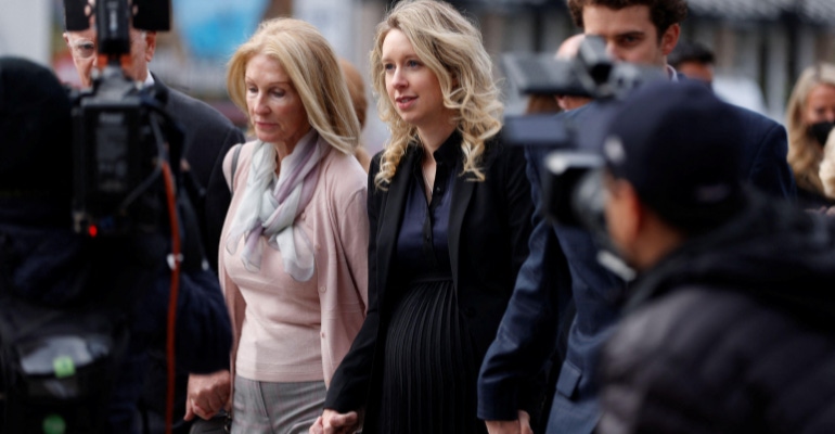 Elizabeth Holmes arrives at the federal courthouse in San Jose, CA on November 18, 2022 with her family and partner Billy