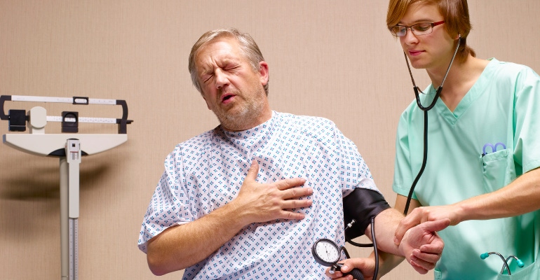 Man with heart disease gets his blood pressure checked in a healthcare setting.