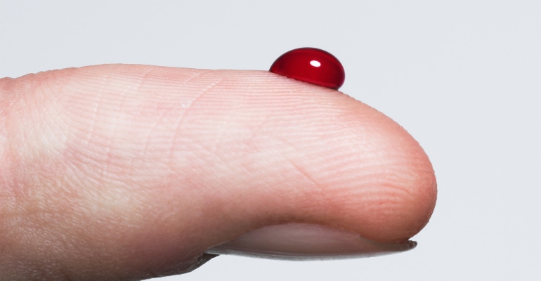 A closeup of a person's finger with a drop of blood.png