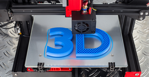 3D printer printing blue "3D" symbol on metal diamond plate 