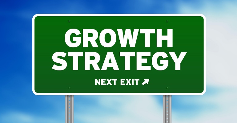 Growth Strategy Next Exit printed on a highway sign, representing Acutus Medical's growth strategy