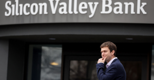 A customer stands outside of a shuttered Silicon Valley Bank (SVB) headquarters on March 10, 2023 in Santa Clara,