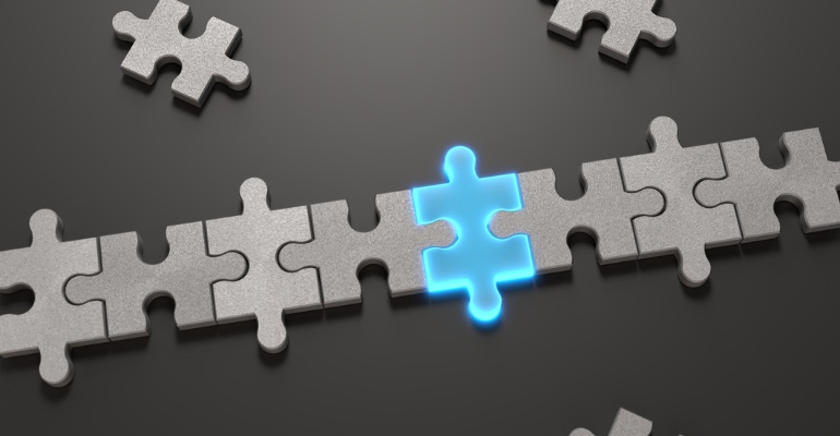 connected puzzle pieces with one piece highlighted in blue to indicate an addition, M&A business concept