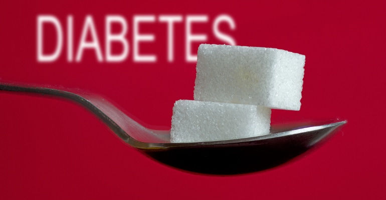 Fractyl wins FDA nod for clinical trial in diabetes - image of two sugar cubes on a spoon with the text DIABETES in the