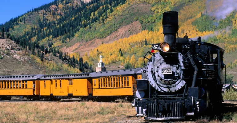 Steam train leaving town on Durango and Silverton Narrow Gauge Railroad.
