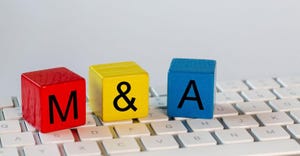 M&A spelled in colorful blocks on top of a computer keyboard - to represent Bioventus acquiring CartiHeal