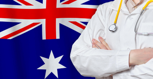 Commonwealth of Australia healthcare concept with doctor on flag background.