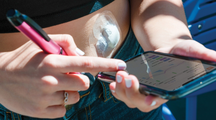 Teenager using a Medtronic InPen System with the company's Guardian Connect CGM sensor to manage diabetes.