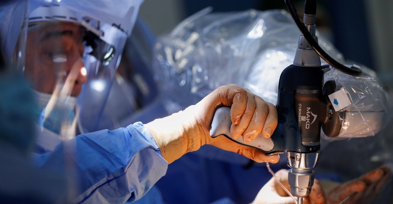 A surgeon uses the Stryker Mako surgical robot on a patient undergoing knee surgery, at the UPMC Salvator Mundi