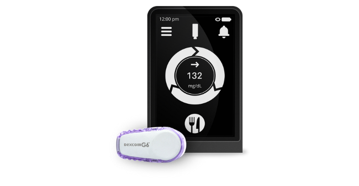Beta Bionics iLet automated insulin delivery system shown with a Dexcom G6 continuous glucose monitoring sensor.png