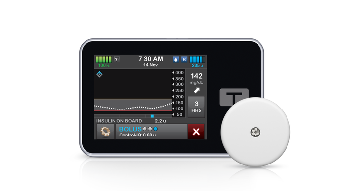 Tandem t:slim X2 insulin pump shown with Abbott's FreeStyle Libre 2 Plus continuous glucose monitoring (CGM) sensor