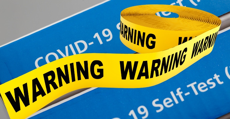 COVID test with warning tape