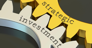 3D rendering of two gear wheels with the words "strategic" and "investment" etched into them