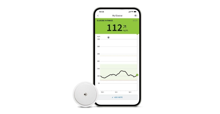 Product photo of Abbott FreeStyle Libre 3 continuous glucose monitoring system and app on iPhone.