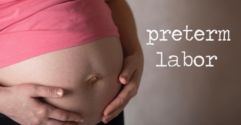 picture of a pregnant woman with the words preterm labor beside her belly