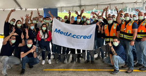 Jabil quality assurance workers celebrating MedAccred award