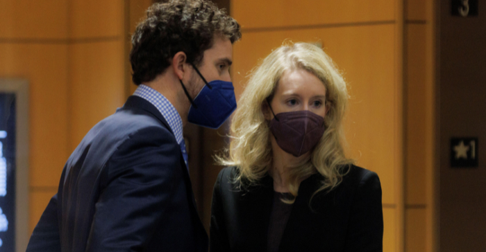 Theranos founder Elizabeth Holmes arrives with her partner Billy Evans, as the jury continued to deliberate in her fraud trial, at federal court in San Jose, California, U.S. December 23, 2021. 