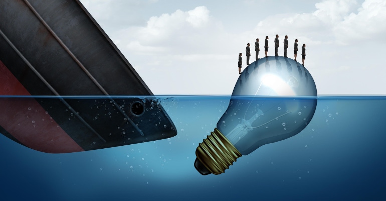 business rescue concept illustrated by an image of a sinking ship and a light bulb