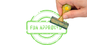 Illustration showing a hand using a rubber stamp, and a green "FDA APPROVED" stamp