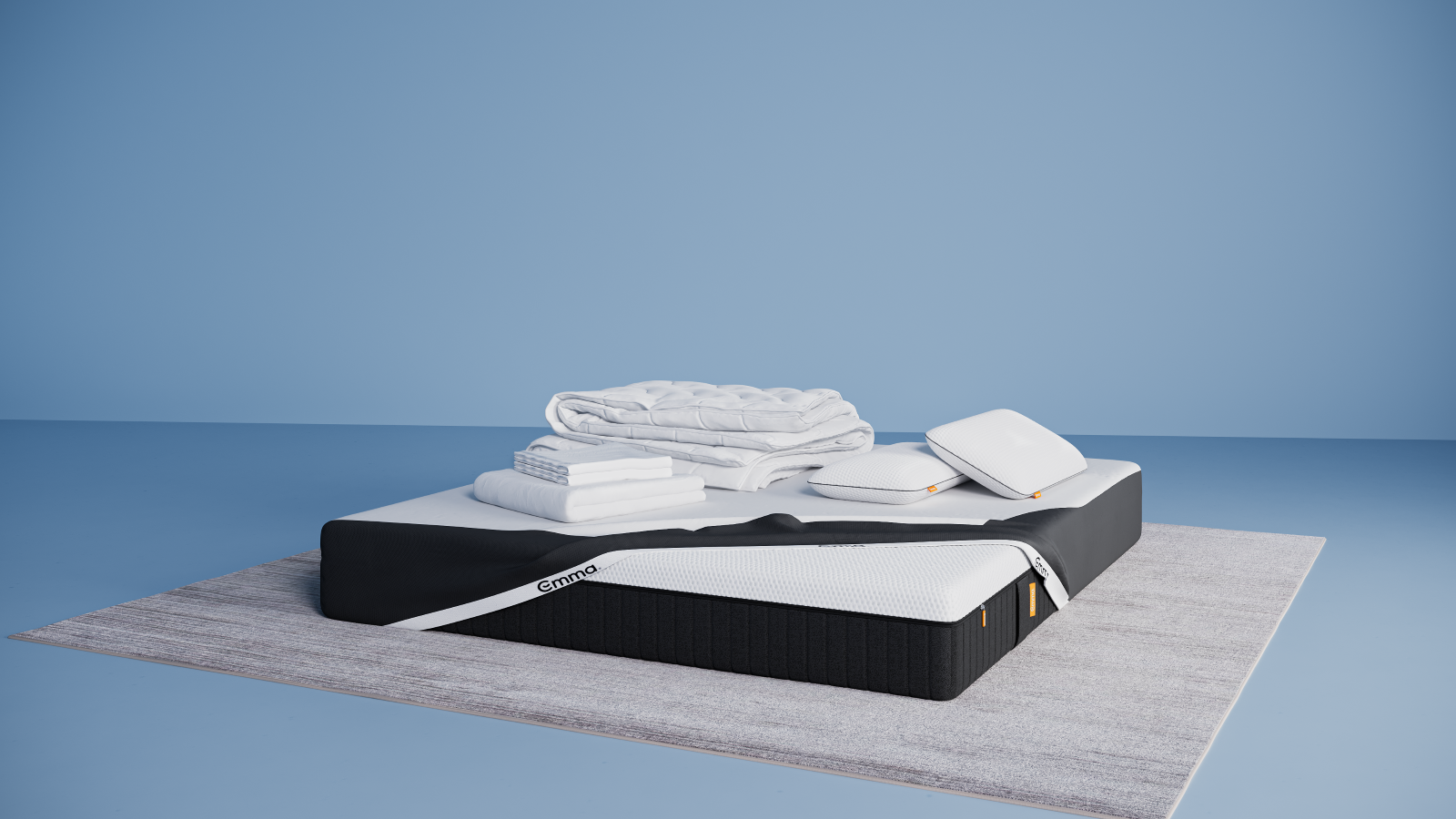 Ensemble de literie présenté dans une chambre moderne : matelas Hybride II ou Hybride Premium II avec base noire et surface blanche, partiellement recouvert d’un plaid gris foncé. Sur le matelas, deux oreillers Nuage Elite 40x70 cm bleus, une couette Nuage Tempérée blanche pliée, un protège-matelas, et une parure de lit en satin de coton blanc comprenant une housse de couette et des taies d’oreillers. Le tout est posé sur un tapis clair, avec une table d’appoint noire à pieds en bois et une décoration minimaliste.