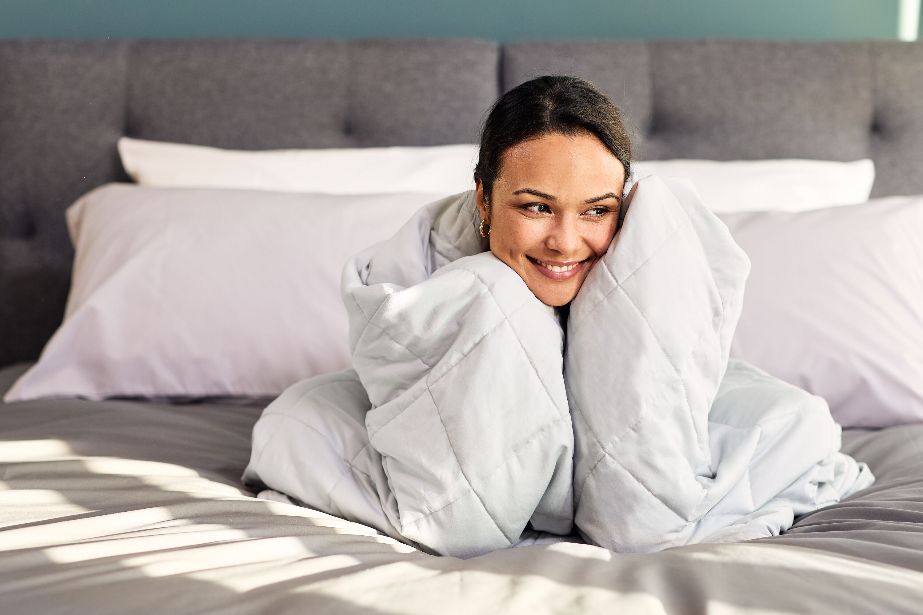 Do you put weighted blanket on top of duvet sale