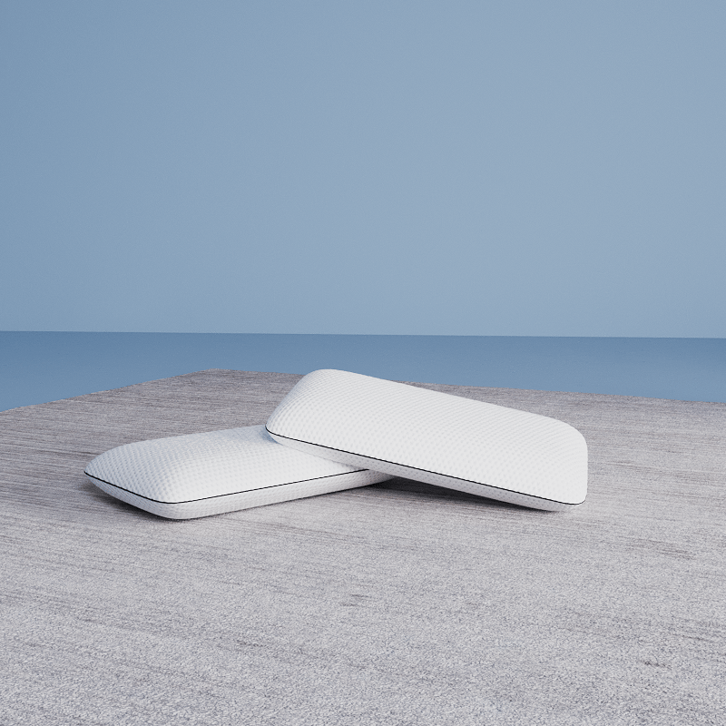 2 almohadas viscoelásticas emma en fondo azul sobre alfombra gris