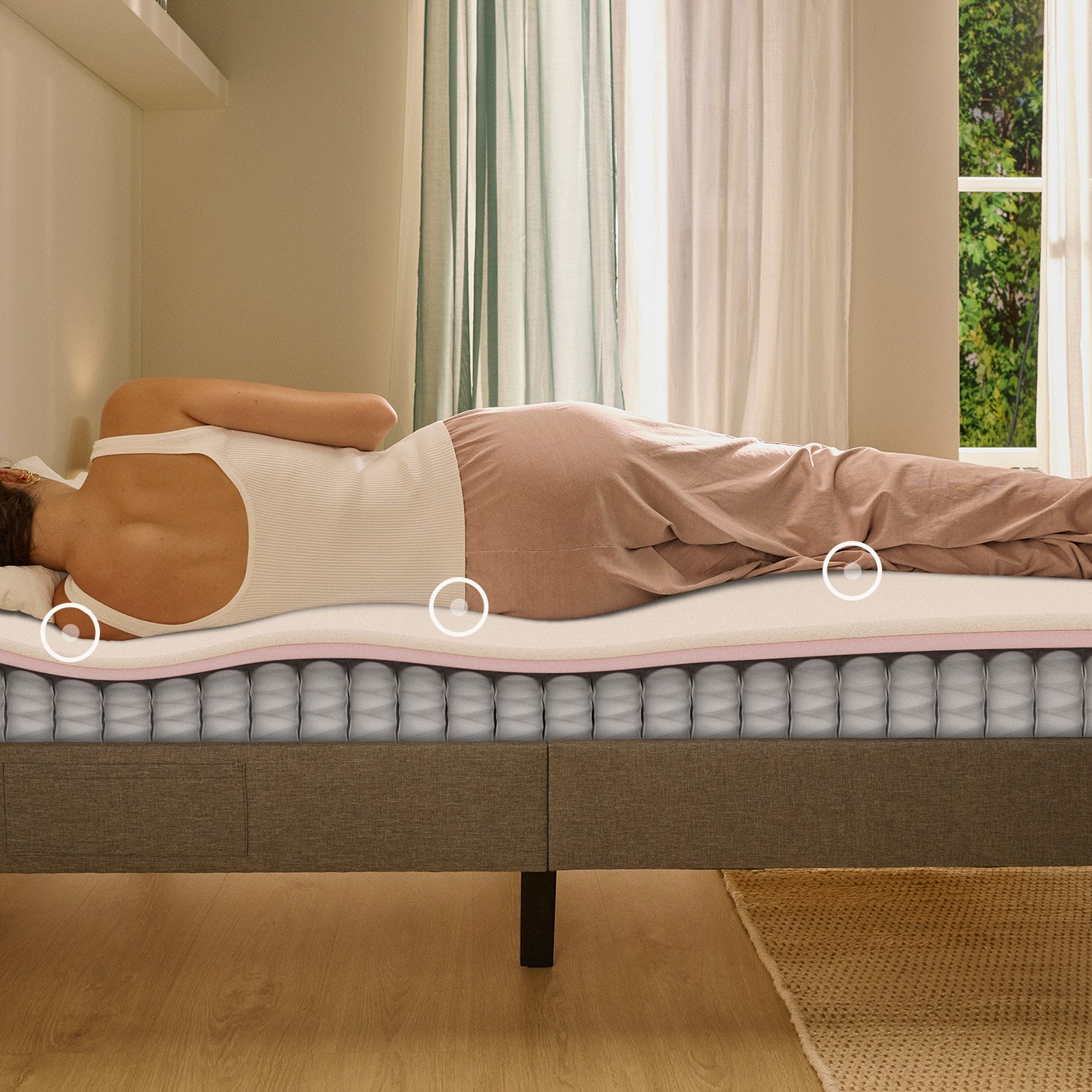 Person lying on their side on a white mattress in a relaxed sleeping position.