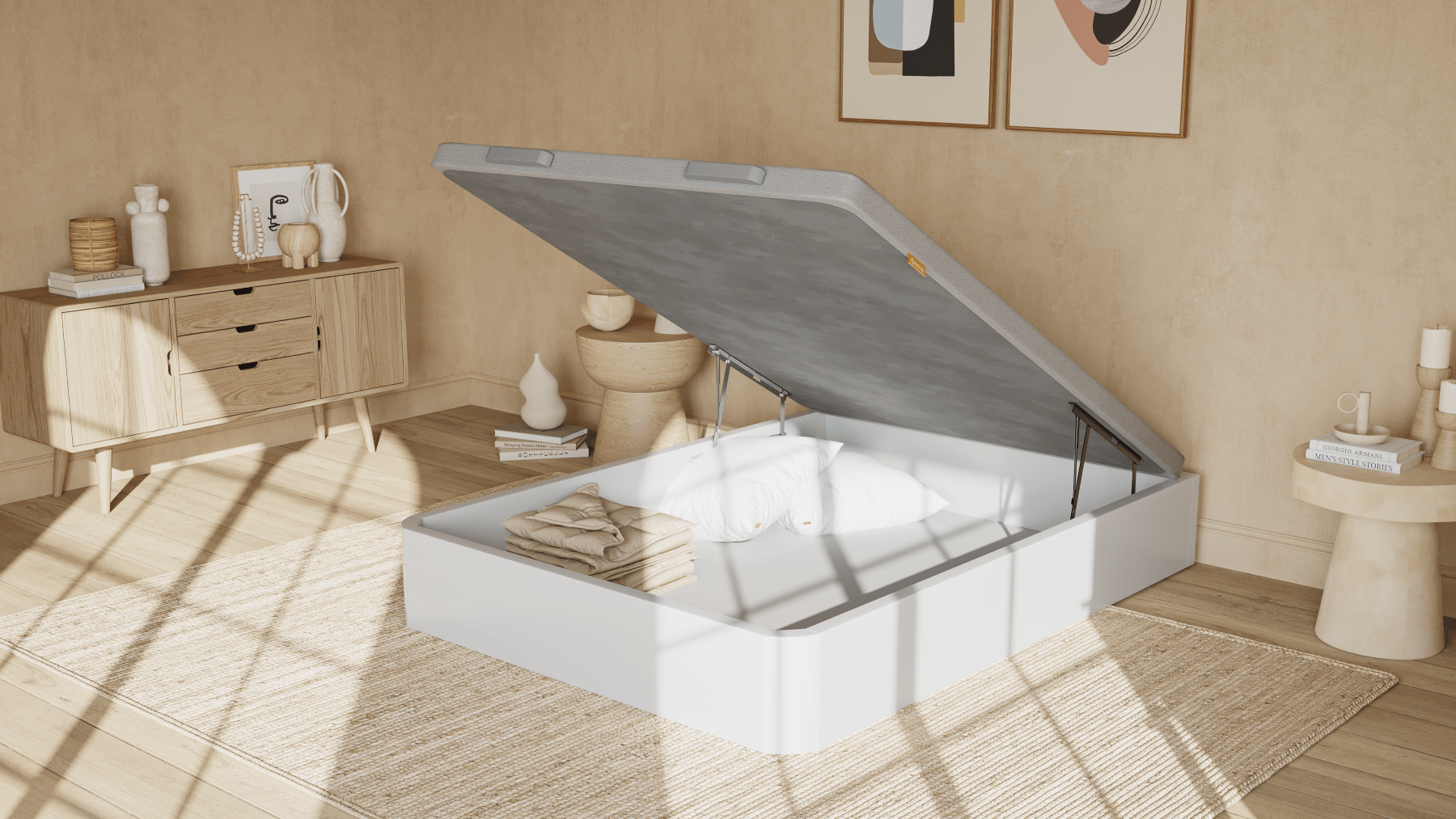 Imagem de um sommier com arumação Emma, com um acabamento branco, com a base levantada, a mostrar o espaço de arrumação da cama.