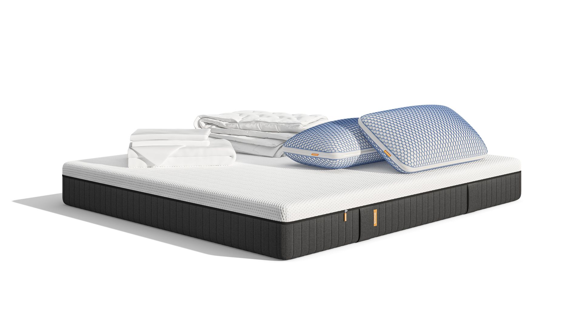 Uma imagem do Pack Conforto Pro+ Plus, que inclui um colchão Original Pro+, Almofadas Emma Original Microfibra Elite, e um edredon Emma quente e roupa de cama