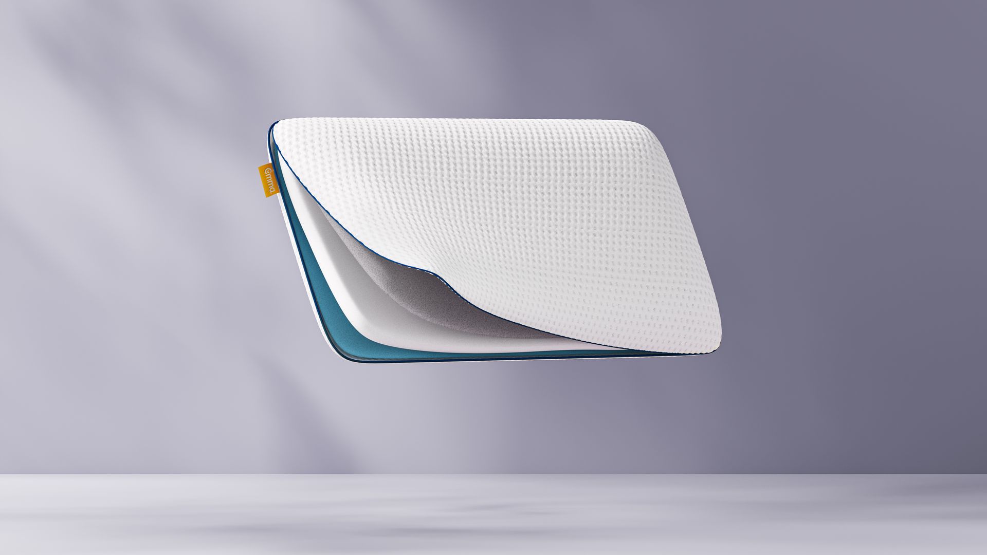 Imagem de uma almofada Emma Premium com um corte lateral, a mostrar as suas camadas