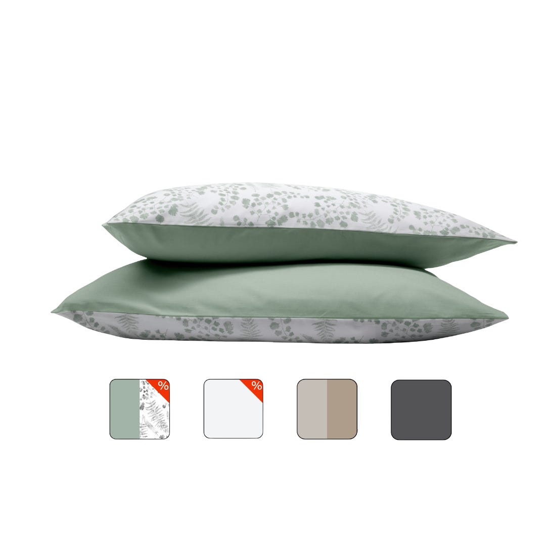 Uma imagem com fronhas de almofada Emma, na cor verde eucalipto