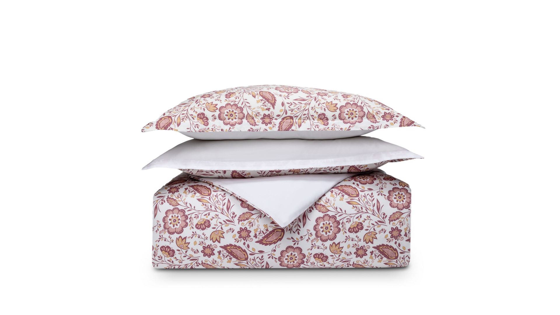 Set di biancheria piegato con motivo floreale rosa e beige su sfondo bianco, cuscino sopra il piumone.