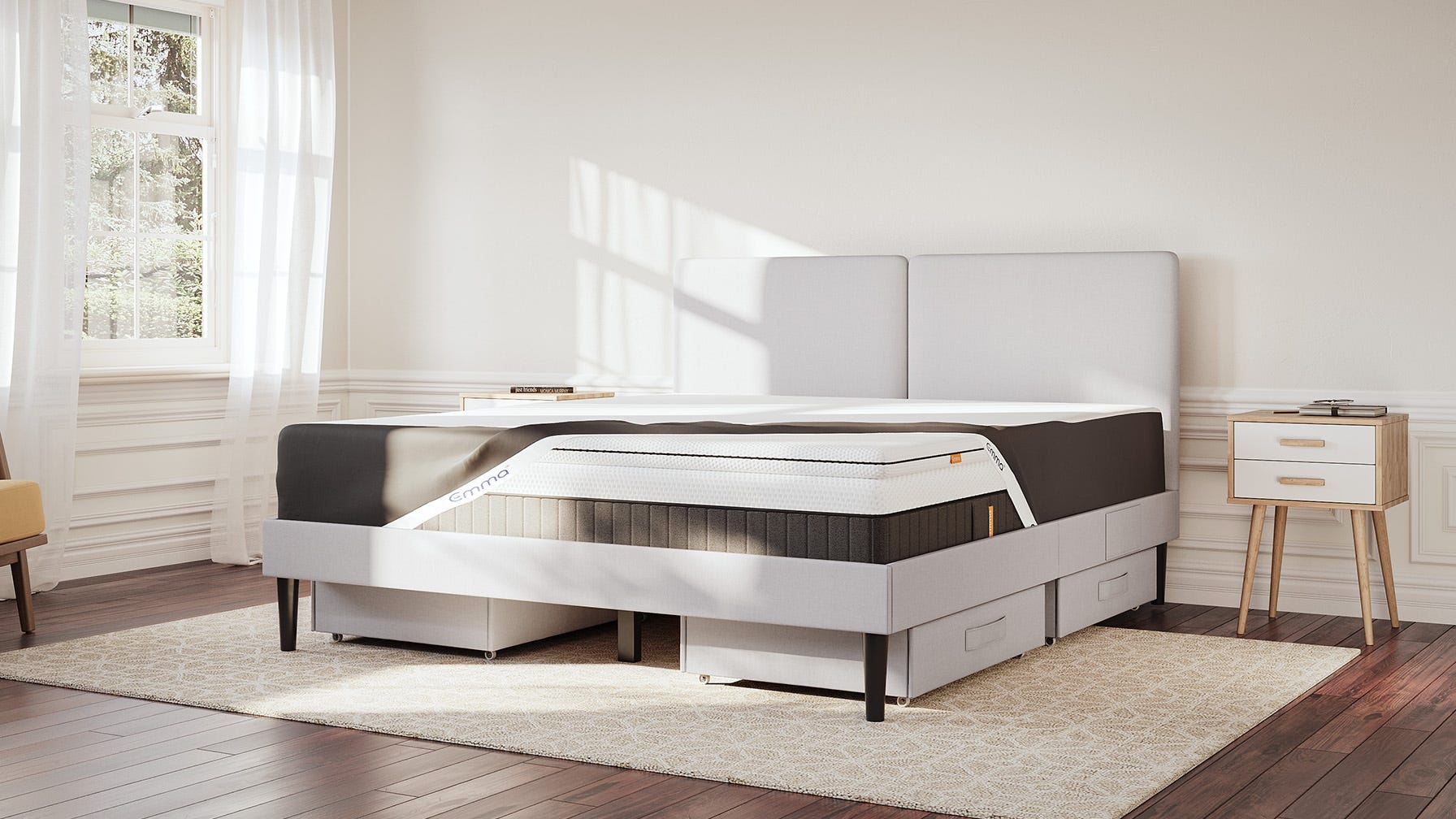 The side view of a bedroom with a bed and a mattress protector tucked in a mattress fitting perfectly.