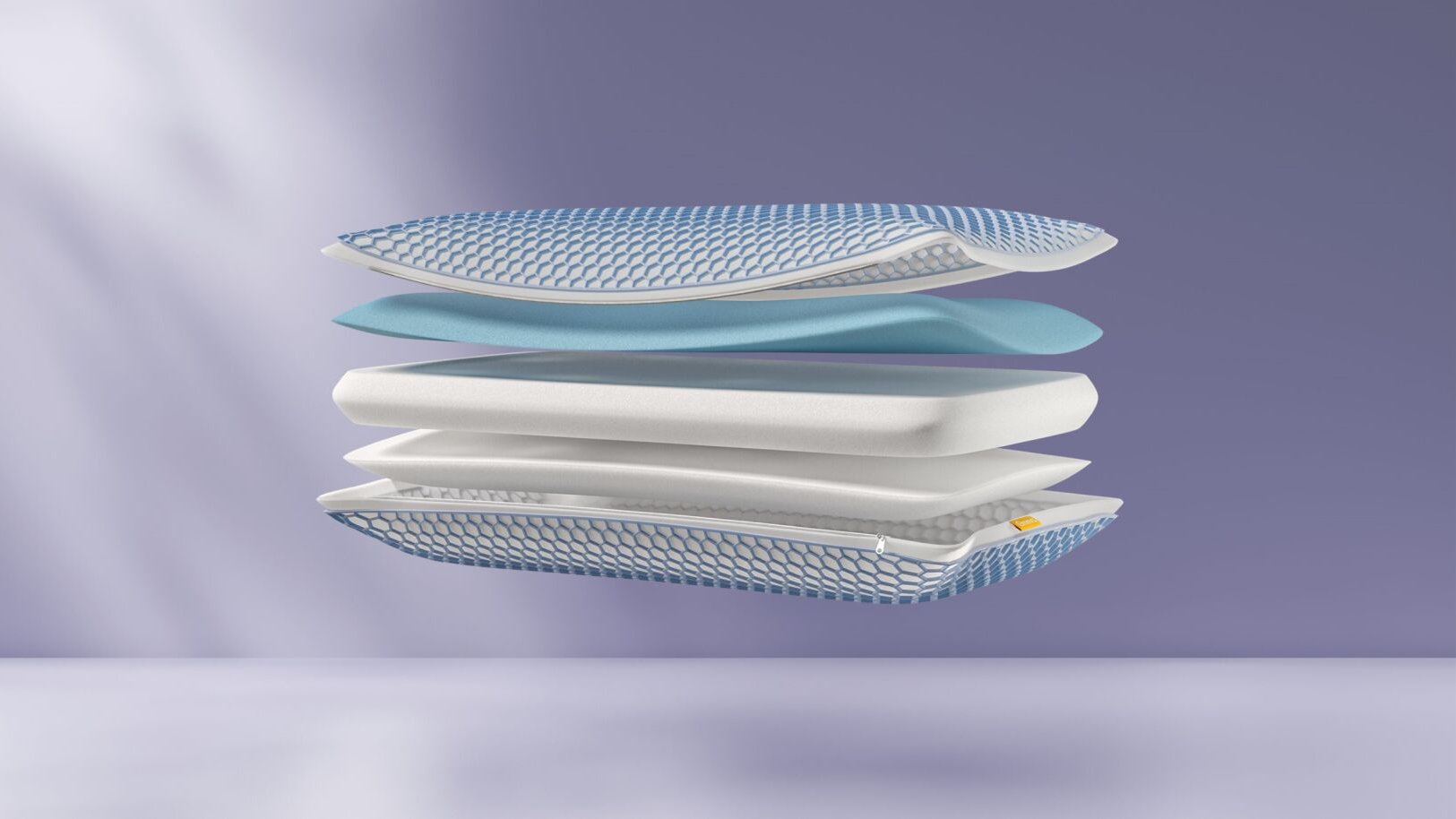 Doorsnede van AirGrid® Adapt Kussens met vier zwevende lagen: bovenlaag met blauw-wit hexagonaal patroon, blauwe schuimlaag, witte kernlaag, en onderste AirGrid® raster.