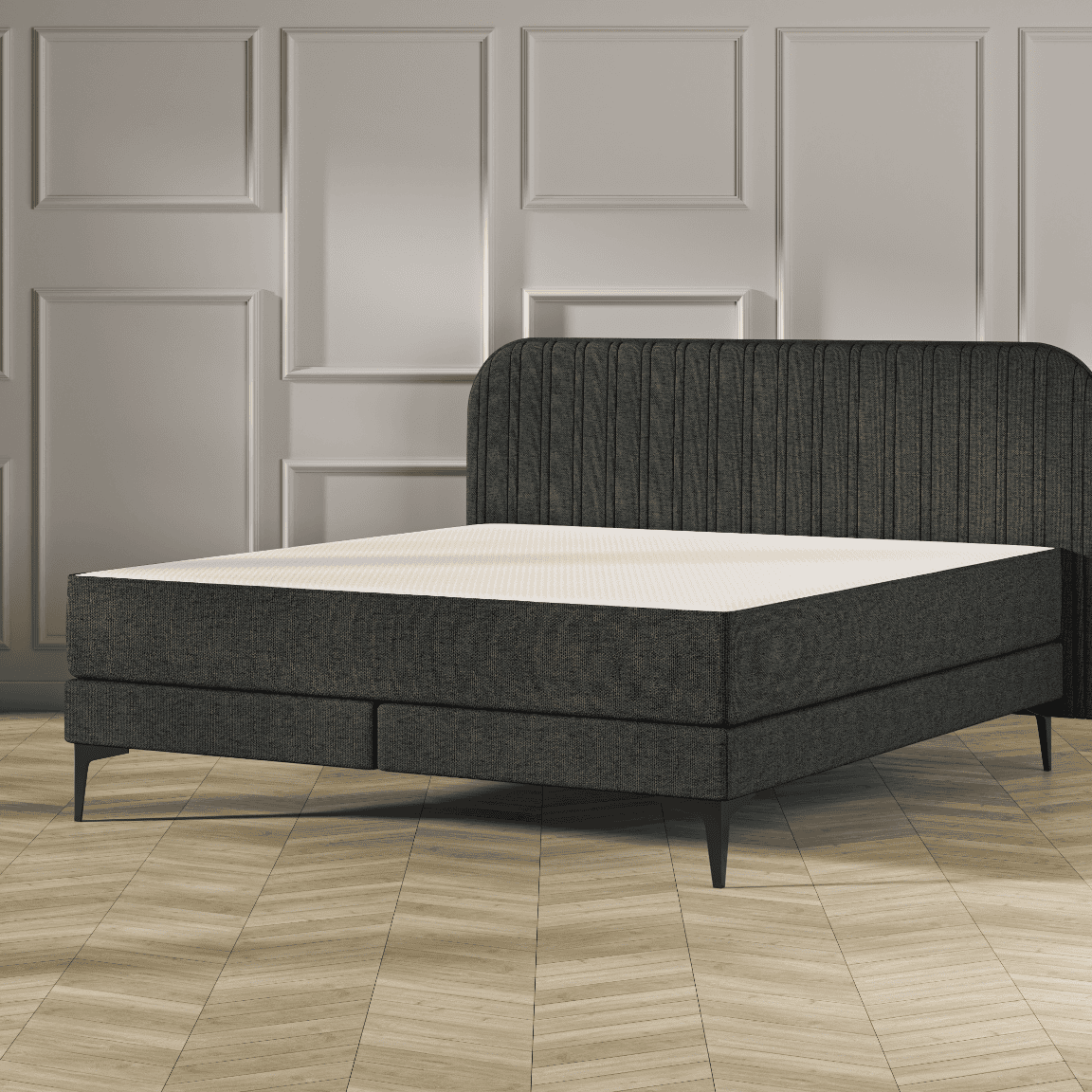 Emma Original Elite Boxspring bed in donkergrijs, met gestreept hoofdbord en metalen pootjes, geplaatst in een stijlvolle slaapkamer met houten vloer.