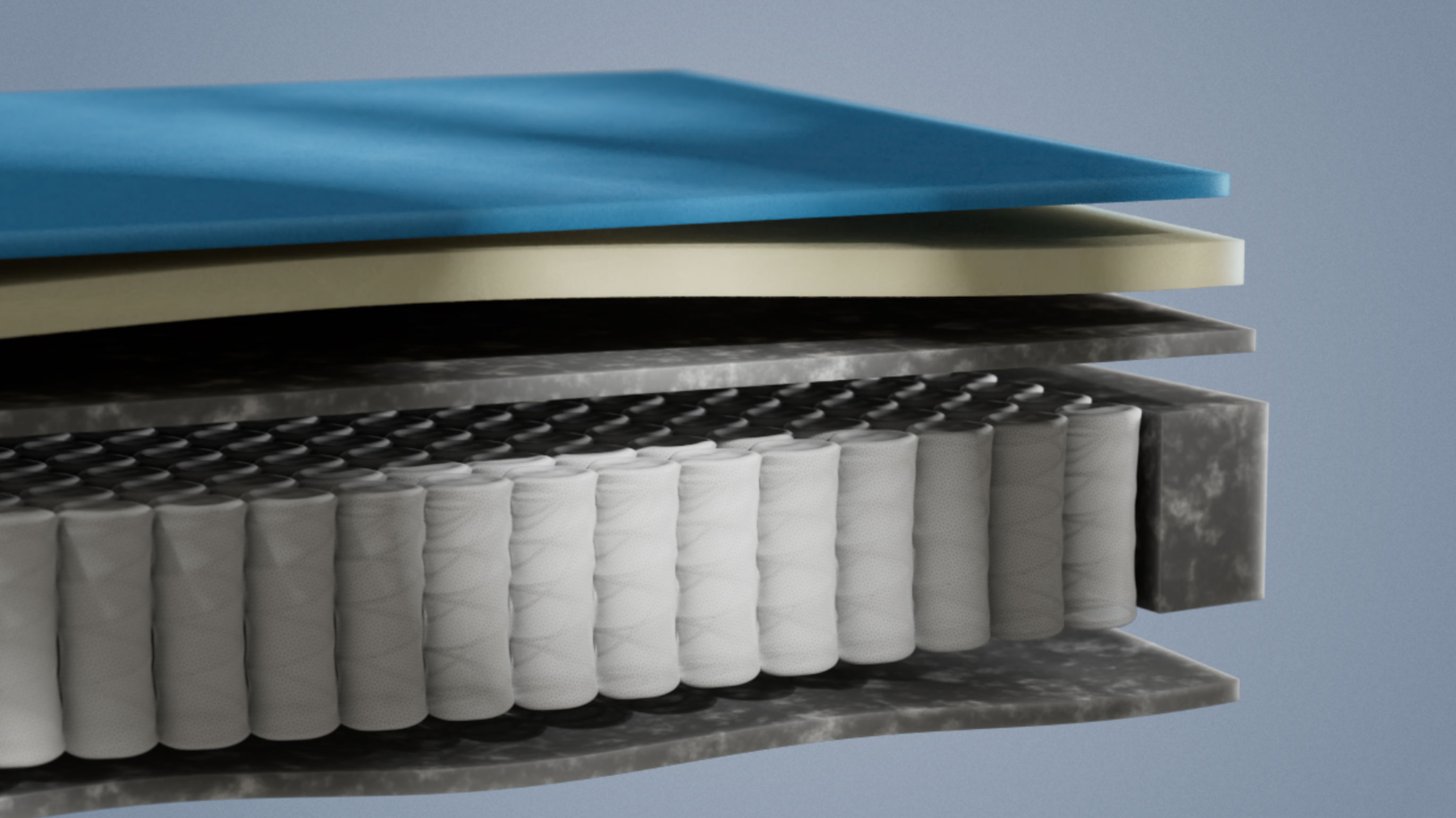 Emma Original mattress layers view showing blue and cream foam layers above a pocket spring core in close-up detail.
