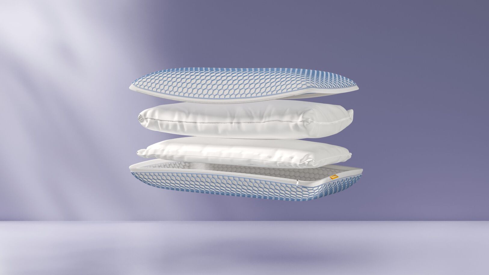 Doorsnede van Emma AirGrid® Wolkenkussen met vier zwevende lagen: boven- en onderlaag met blauw-wit hexagonaal raster, twee tussenlagen van wit en blauw schuim met verschillende texturen, tegen neutrale achtergrond.