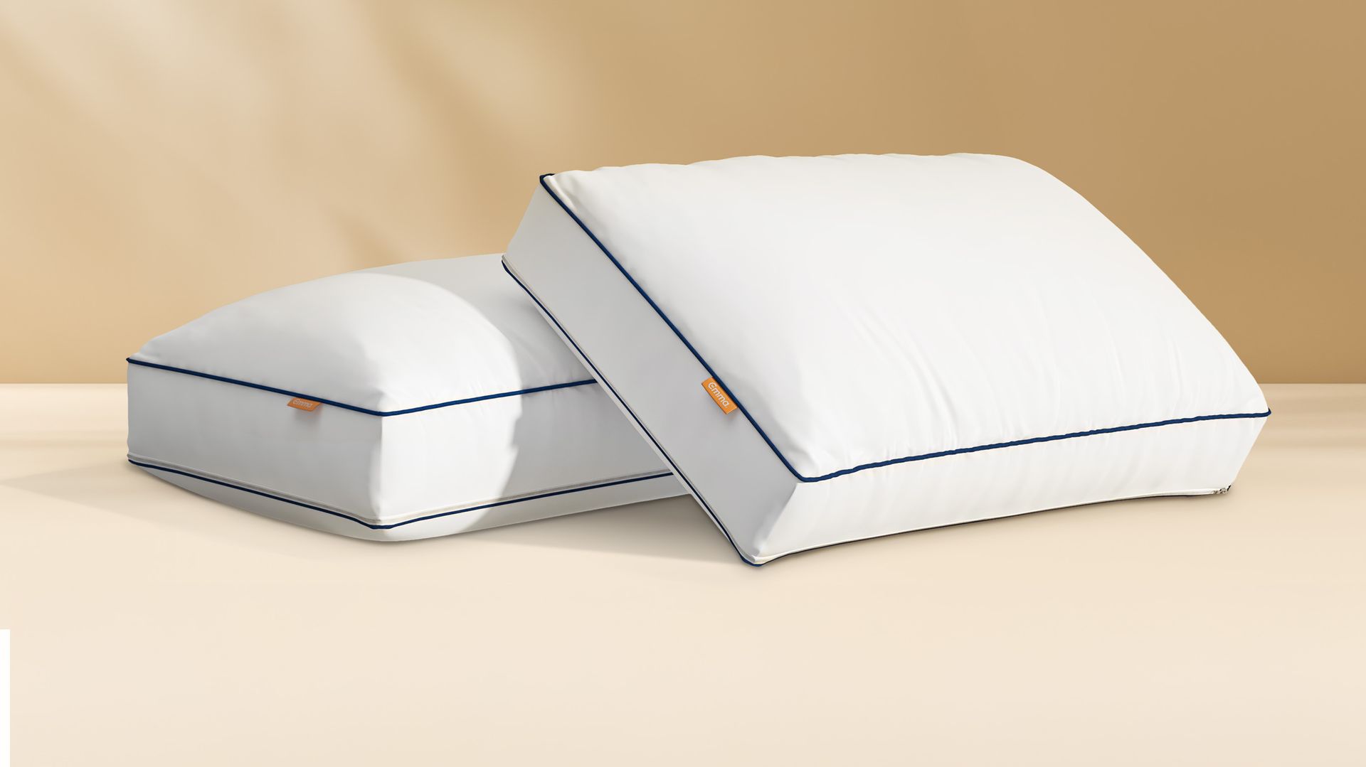 Two Hybrid Pillows on a golden background.