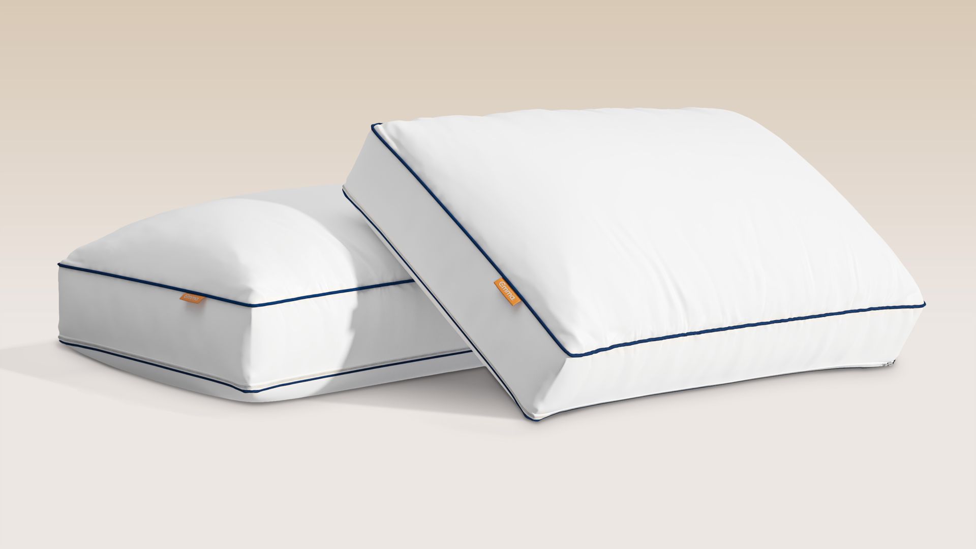 Two Hybrid Pillows on a golden background.