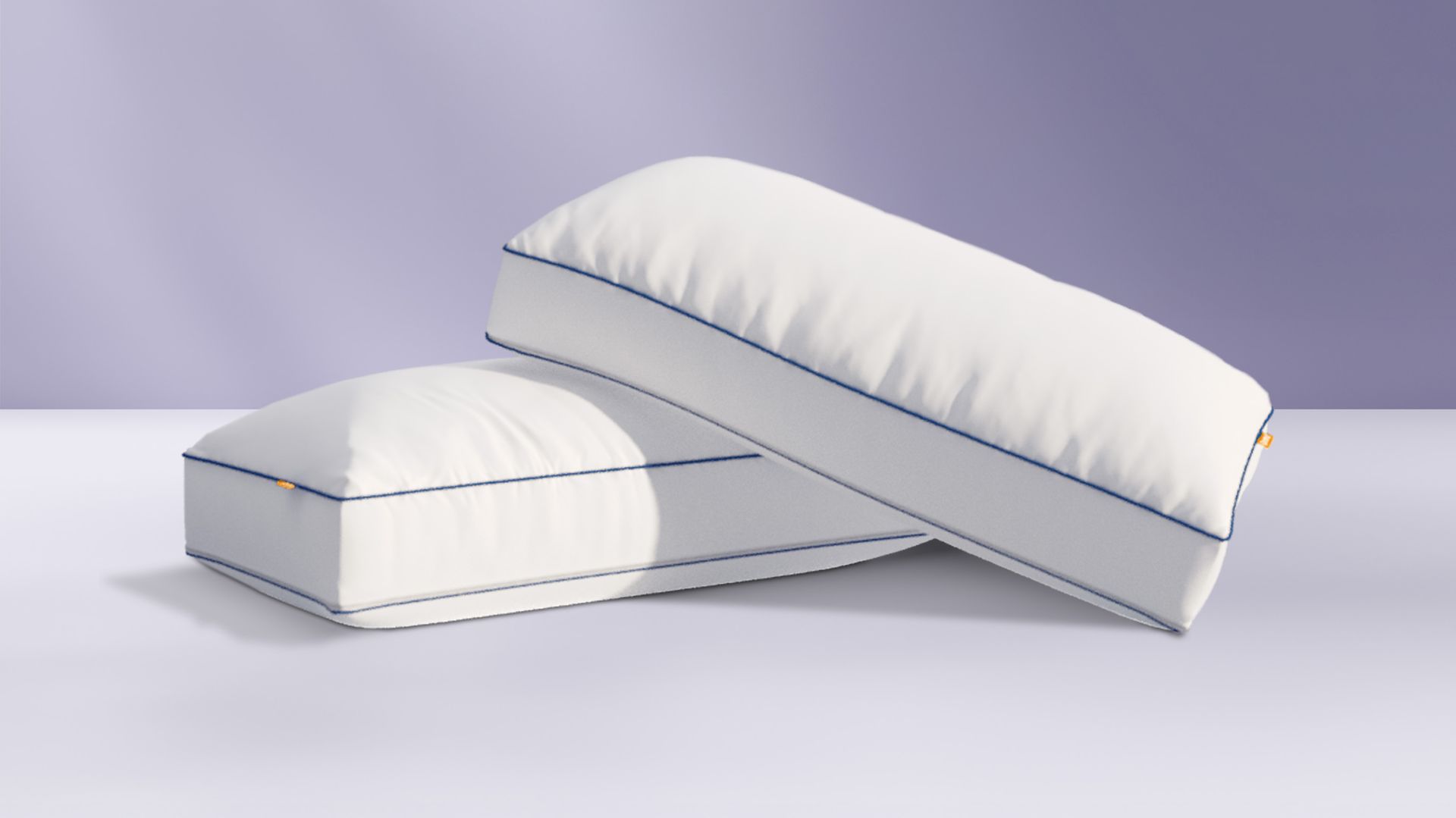 Two Comfort Cooling pillows on a grey background.