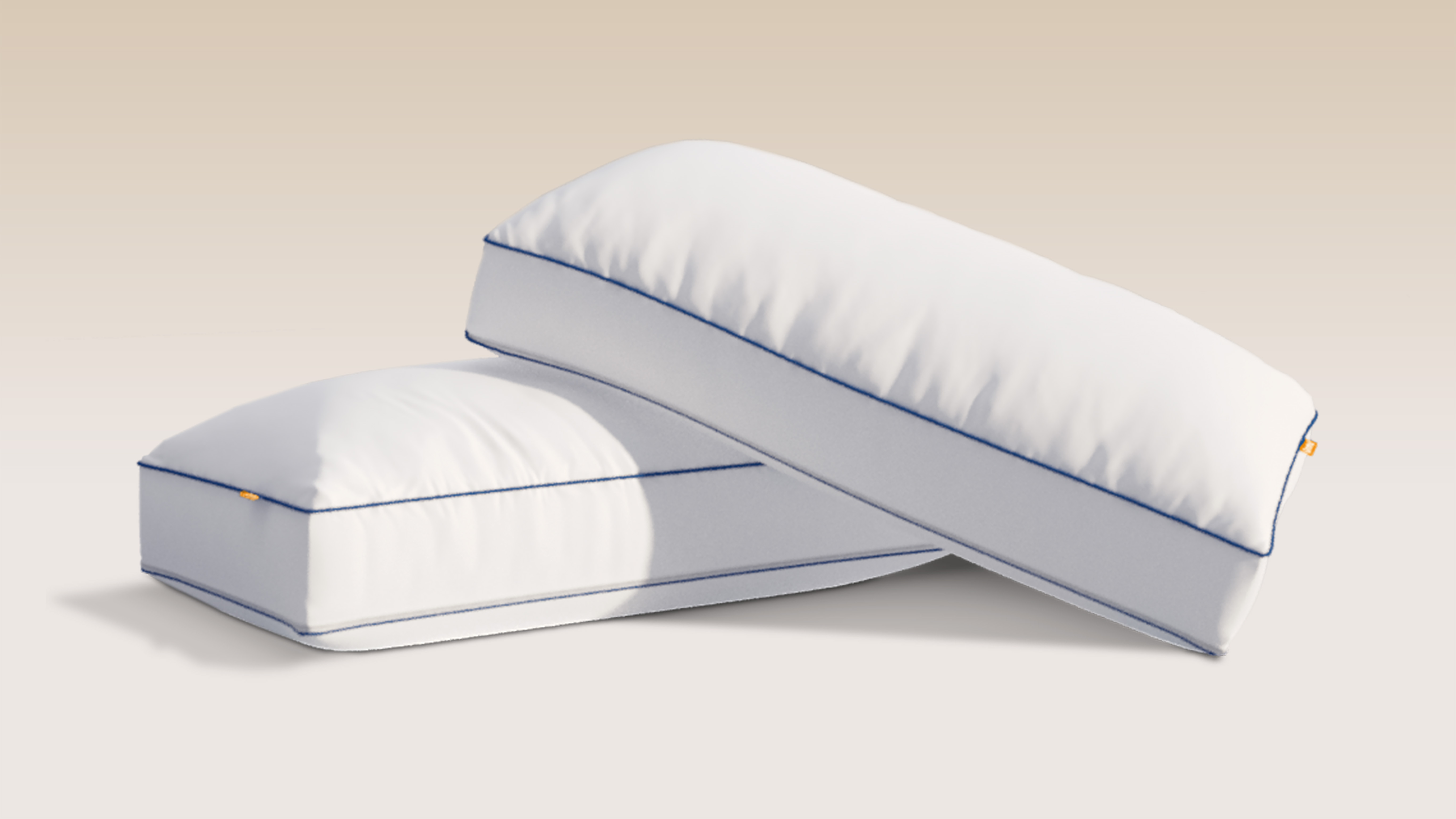 Two Comfort Cooling pillows on a grey background.