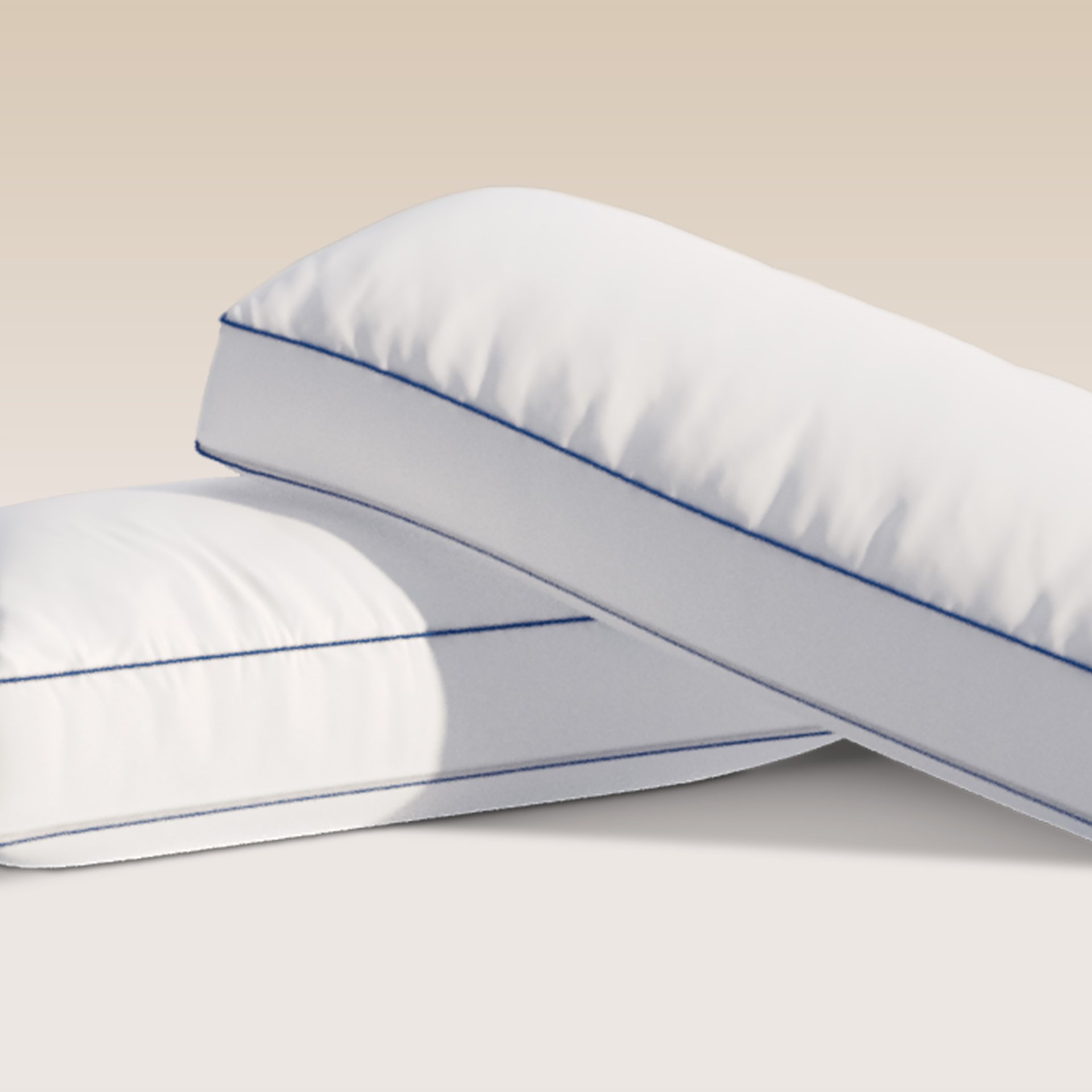 Two Comfort Cooling pillows on a grey background.